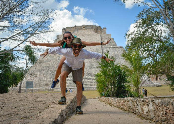 Persons in front of Uxmal ruins